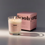 Scented candle with a pink label and 'Soohyang' box on a gray background